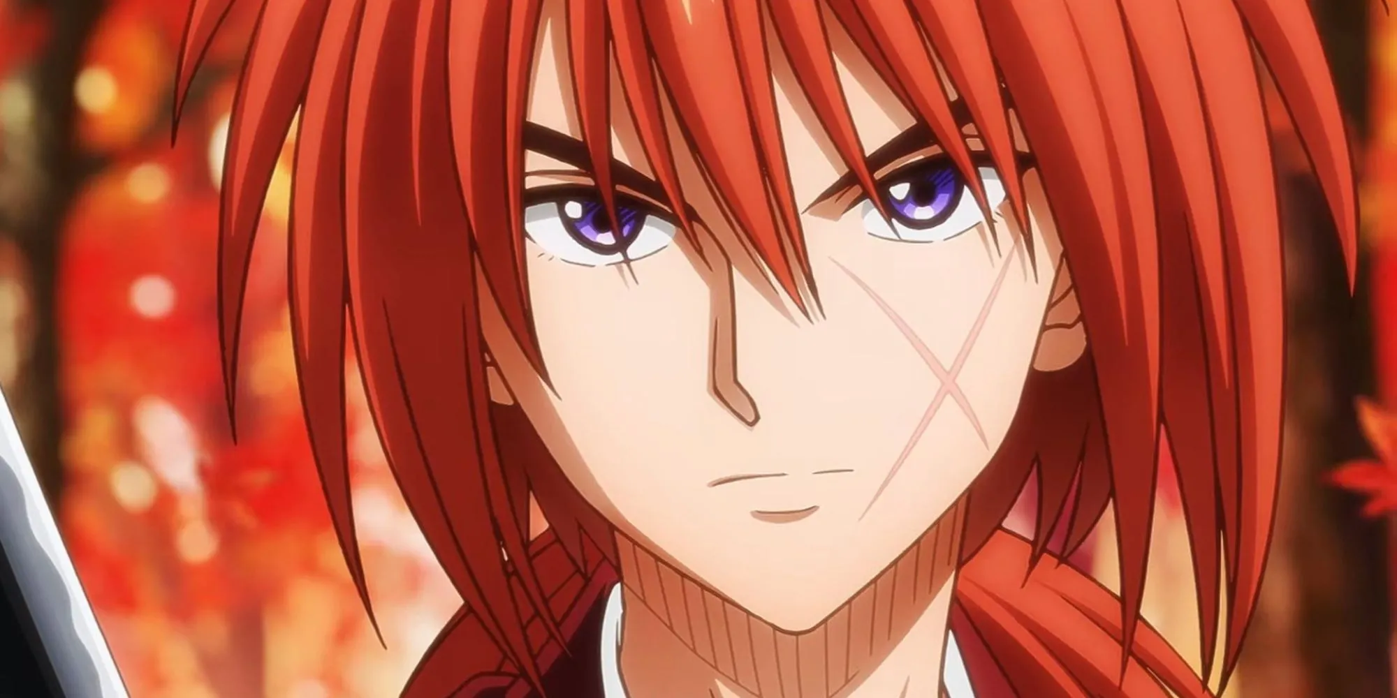 Himura Kenshin với thanh sakabatō đặc trưng, mái tóc đỏ và vết sẹo chữ thập