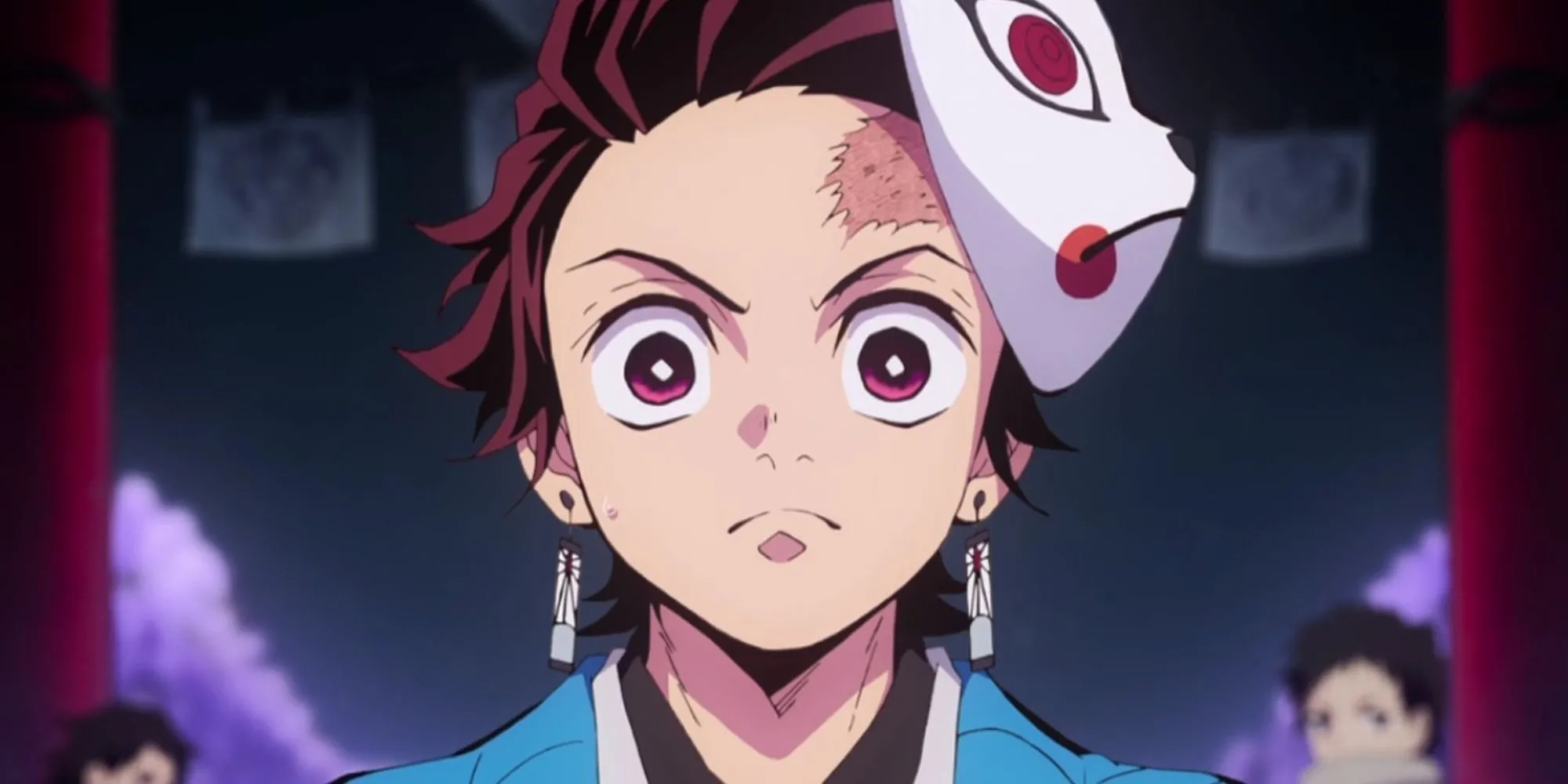 Tanjiro Kamado với biểu cảm nghiêm túc, quyết tâm bảo vệ Nezuko trong Demon Slayer