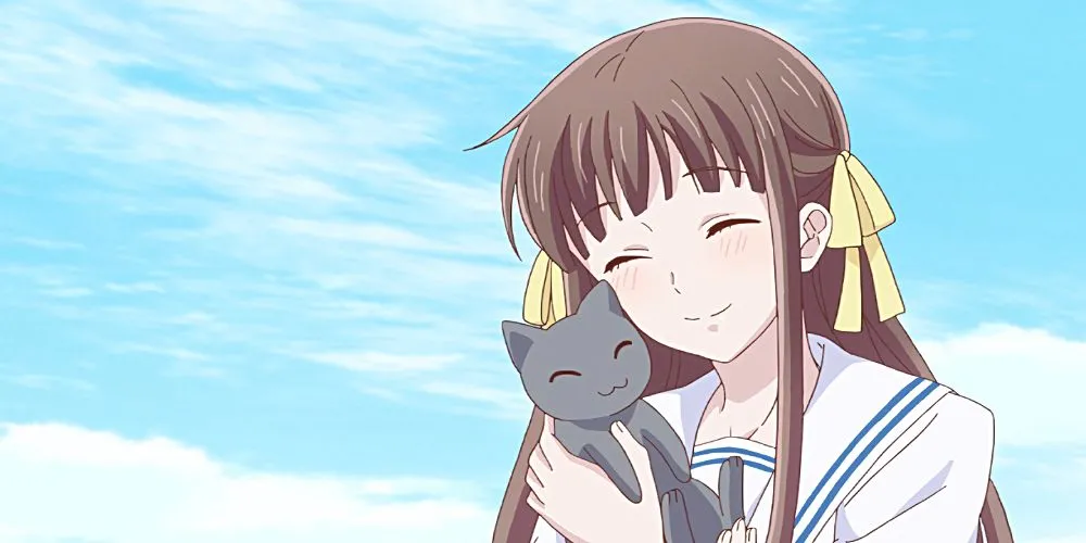 Tohru Honda trong Fruits Basket với nụ cười ấm áp, hình ảnh đại diện cho nhân vật học cách buông bỏ nỗi đau mất mẹ và chấp nhận tình yêu thương từ người khác